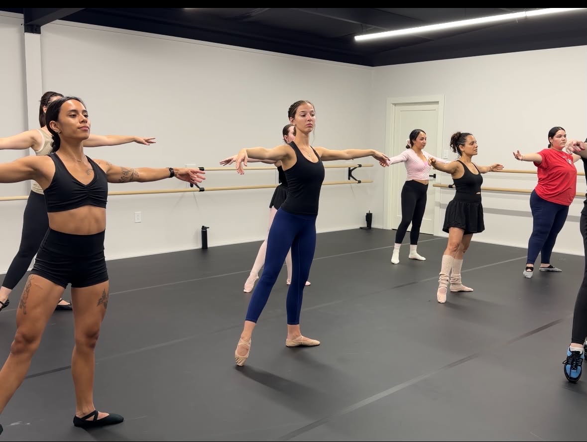 Ballet class practicing at the barre at Elevate Dance Studio